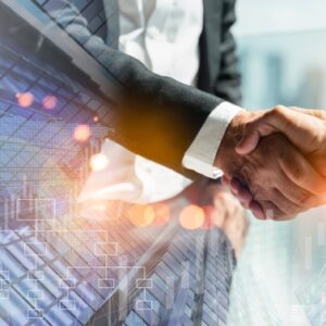 Business professionals shaking hands in front of modern financial data overlay, representing strategic partnerships and growth funding.