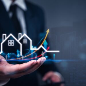 Business professional presenting real estate investment growth with asset-backed lending graph