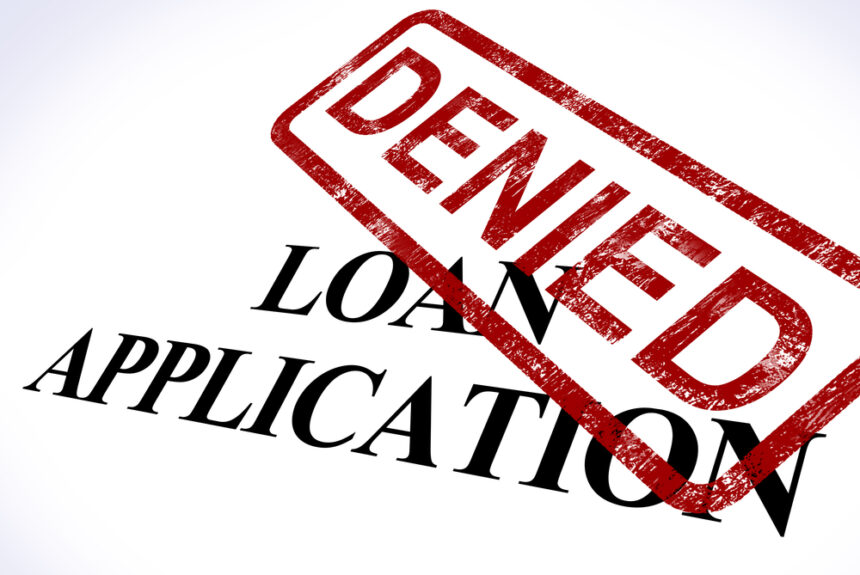Denied small business loan application stamp showing rejection