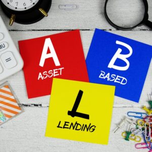 Colorful cards showing A for Asset, B for Based, and L for Lending with office supplies on a desk