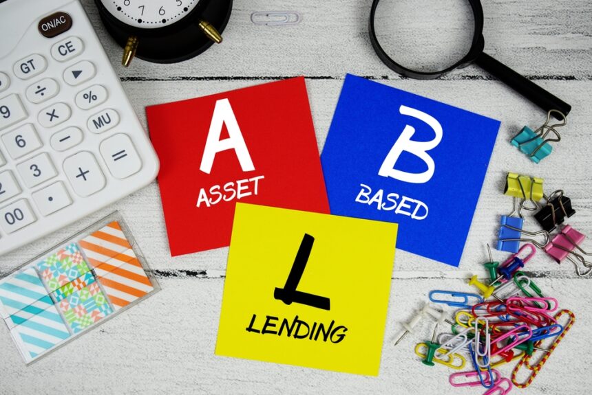 Colorful cards showing A for Asset, B for Based, and L for Lending with office supplies on a desk