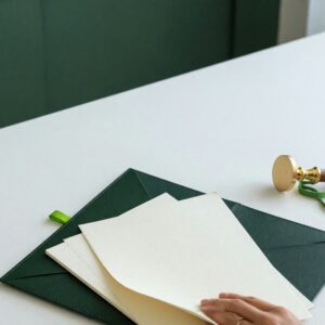 ab2116-hero-3 Commercial financing contracts and a blank brass seal stamp on a bright desk, illustrating California AB 2116 licensing for business finance providers.